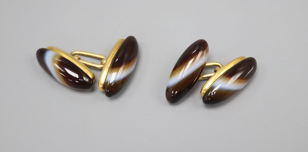 A pair of yellow metal and agate cufflinks